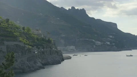 Scenic view with mountain with dramatic clouds facing the ocean Stock Footage 169473510