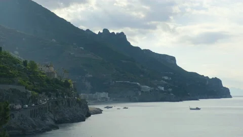 Scenic view with mountain with dramatic clouds facing the ocean Stock Footage 169473848