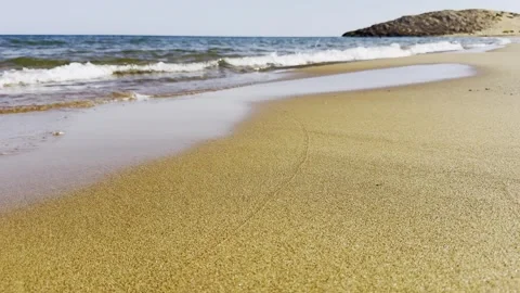 Scenic view of ocean waves breaking on sandy shore Stock Footage 343531152