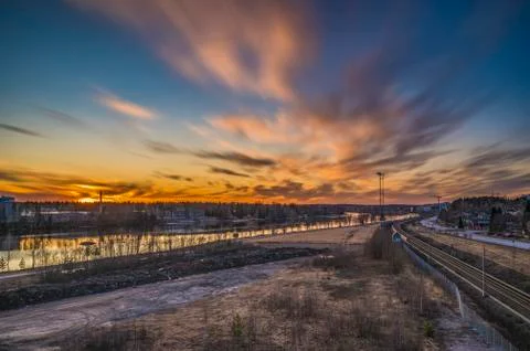 The scenic view of passing cloud during the evening sunset with cityscape adv Stock Photos
