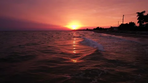Scenic view of pink sunset reflecting in the sea. 4K Video Stock Footage 164880951