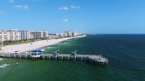 Scenic view of Pompano Beach showcasing beautiful coastline and pier extending Stock Footage 274286253