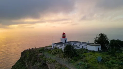 Scenic view of the Ponta do Pargo lighthouse on a cliff above the atlantic .. Stock Footage 327773528
