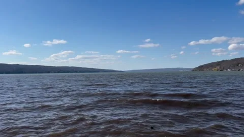 Scenic view of powerful sea waves breaking on rocky coastline with horizon ship Vidéo 334163617