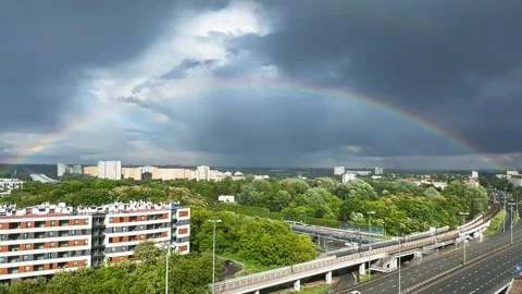 Scenic view of rainbow over buildings in city against sky,Poland, Skyscrapers in Stock Footage 309883080