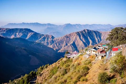 A scenic view of a remote mountain settlement perched on a steep hillside wit Stock Photos