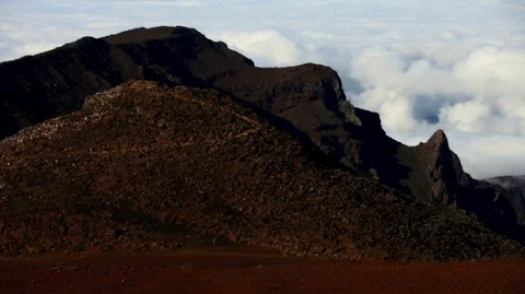 Scenic view of a remote volcanic landscape with billowing clouds in the Stock Footage 88342886