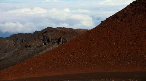 Scenic view of a remote volcanic landscape with billowing clouds in the Stock Footage 88342889