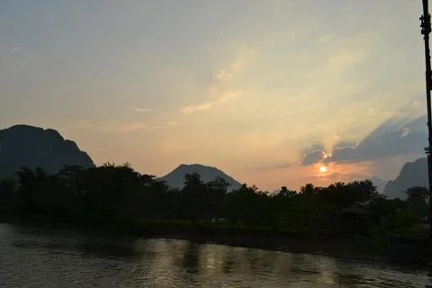Scenic view of river against sky during sunset Foto stock
