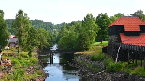 Scenic view of a river running through a green landscape in Norway with his.. Stock Footage 340210364