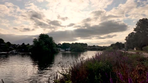 A scenic view of the River Thames at Richmond during golden hour showcases a Vídeos de archivo 327457000