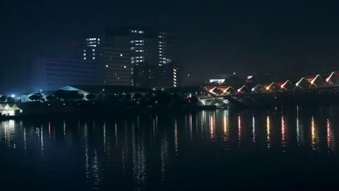 Scenic view of River water reflection - Lights of a Building and Bridge Stock Footage 219204022