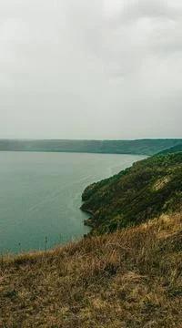 Scenic view of a river winding through hills and forests in a remote area d.. Stock Photos
