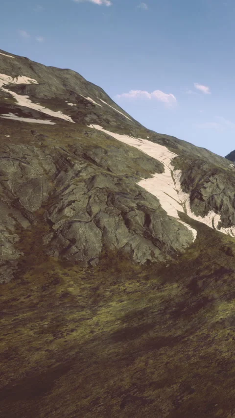 Scenic view of rocky hillside with patch of snow under clear sky Stock Footage 331666722