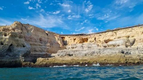 Scenic view of rugged limestone cliffs rising above the Atlantic Ocean with c Фото