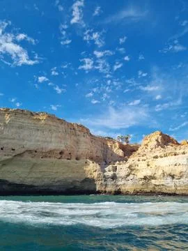 Scenic view of rugged limestone cliffs rising above the Atlantic Ocean with c Stock Photos
