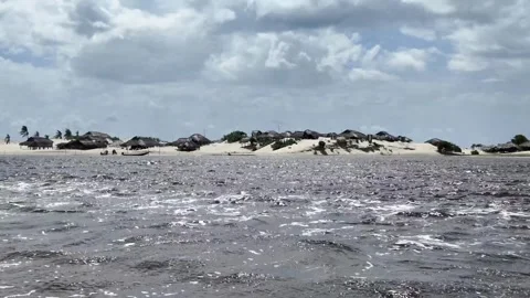 Scenic View of Sand Dunes and Fishing Village Huts along Preguicas River Brazil Stock Footage 340917077