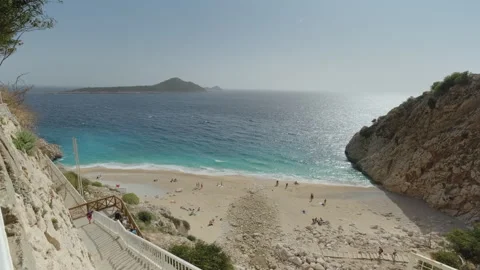 Scenic View of a Secluded Beach with Turquoise Waters Stock Footage 282936674