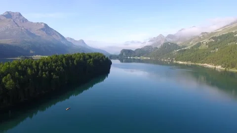 Scenic view of serene lake surrounded by mountains Stock Footage 320303955