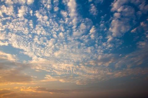Scenic view of the sky with clouds during sunset in cityscape Stock Photos