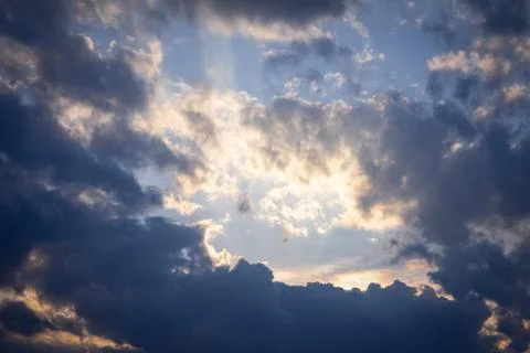 Scenic view of the sky with clouds during sunset in cityscape Stock Photos