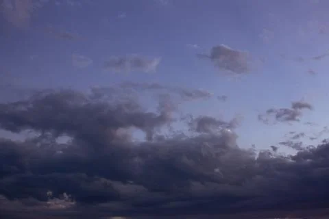 Scenic view of the sky with clouds during sunset in cityscape Stock Photos