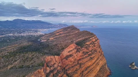 Scenic view of stratified rocks and erosion patterns along rugged seaside during Stock Footage 342360928
