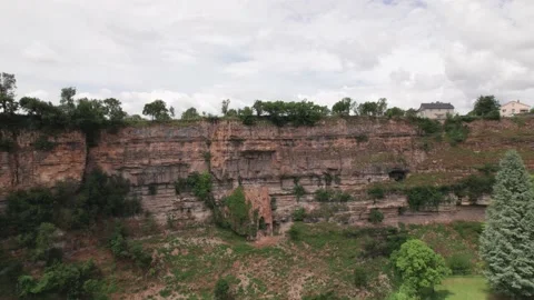 Scenic View Of Structures On Limestone Cliffs Against Cloudscape Sky. - Stock Footage 158368437