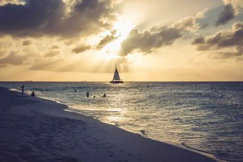 Scenic view of a sunset in the Eagle Beach. Caribbean landscape. Stock Photos