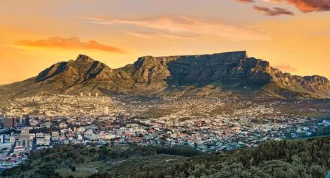 Scenic view of Table Mountain and city at Sunrise, Cape Town, South Africa Stock Photos