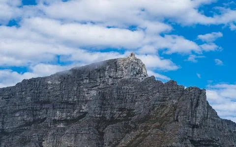 Scenic view of Table mountain top cable way station with white fluffy clouds Stock Photos