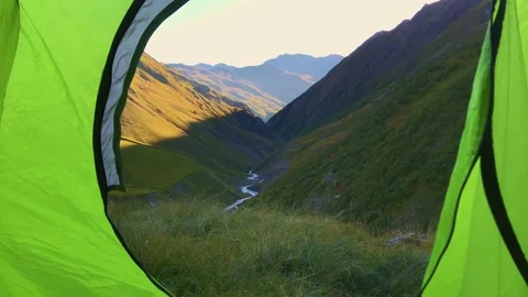 Scenic view from tent window to relaxing georgian mountains background. Cauca Stock Footage 145970691