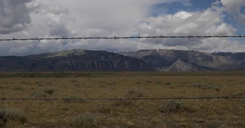Scenic view through barbed wire 4k 24fps Stock Footage 79831905