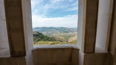 Scenic View Through Stone Window Frame Stock-Fotos