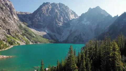Scenic view of a tranquil lake surrounded by mountains Stock Footage 320290468