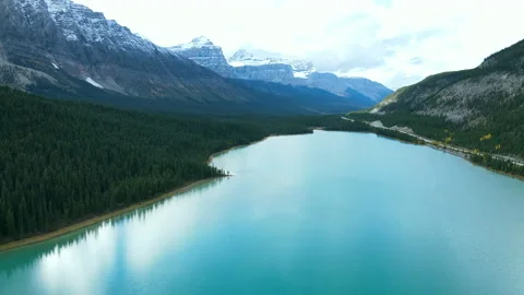 Scenic View of water in a mountain forest lake with pine trees Stock Footage 200359715