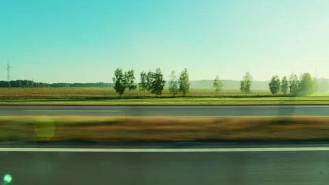 Scenic view from window of car on rural highway during summer journey, showing Stock-Footage 339864676