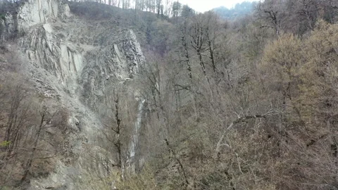 Scenic Waterfall Between Forested Mountains. Aerial view Stock Footage 303589591
