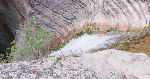 Scenic waterfall between rocky cliffs in countryside Stock Footage 245773083