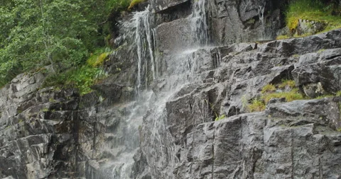 Scenic waterfall cascading down a rocky mountain in norway Stock-Footage 326352977