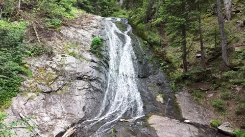 Scenic waterfall cascading over wet rocks Stock Footage 340359887