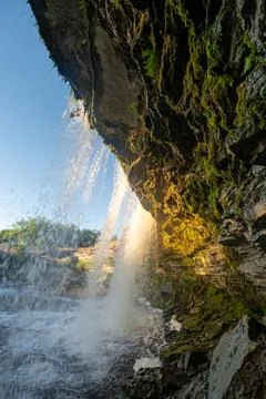 Scenic waterfall closeup in the sunset rays. Jagala Waterfall. Stock Photos