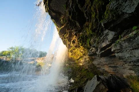 Scenic waterfall closeup in the sunset rays. Jagala Waterfall. Stock Photos