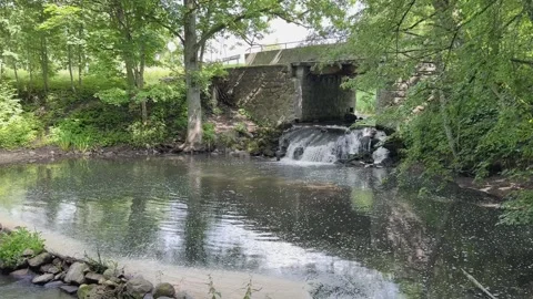 Scenic waterfall by stone bridge Stock-Footage 320949768
