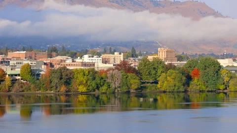 Scenic Wenatchee cityscape with low level clouds along Wenatchee river in W.. Stock Footage 320149276