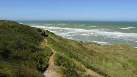 Scenic windy coastal path overlooking a rough sea Stock-Footage 338328982