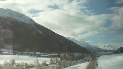 Scenic winter train journey through snowy swiss alps valley Stock-Footage 328706988