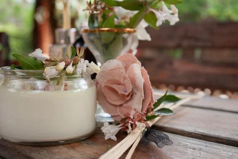 Scented candle and aroma diffuser with fwhite flowers Stock Photos