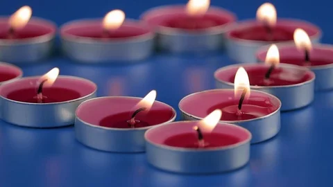 Scented candles on a blue background. Stock Footage 121676017