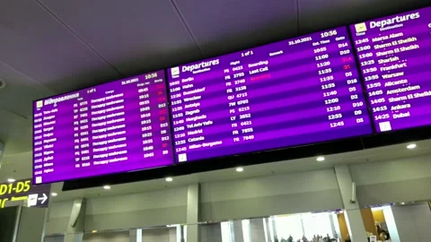 Scheduled flights on digital timetable board with informatio Stock Footage 194907527